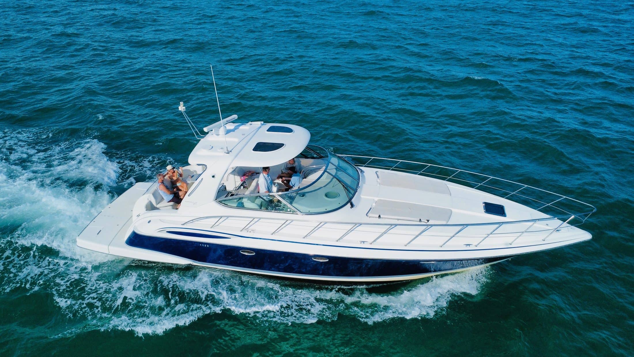Aerial view of the Top Fun yacht cruising turquoise Gulf water near Anna Maria Island