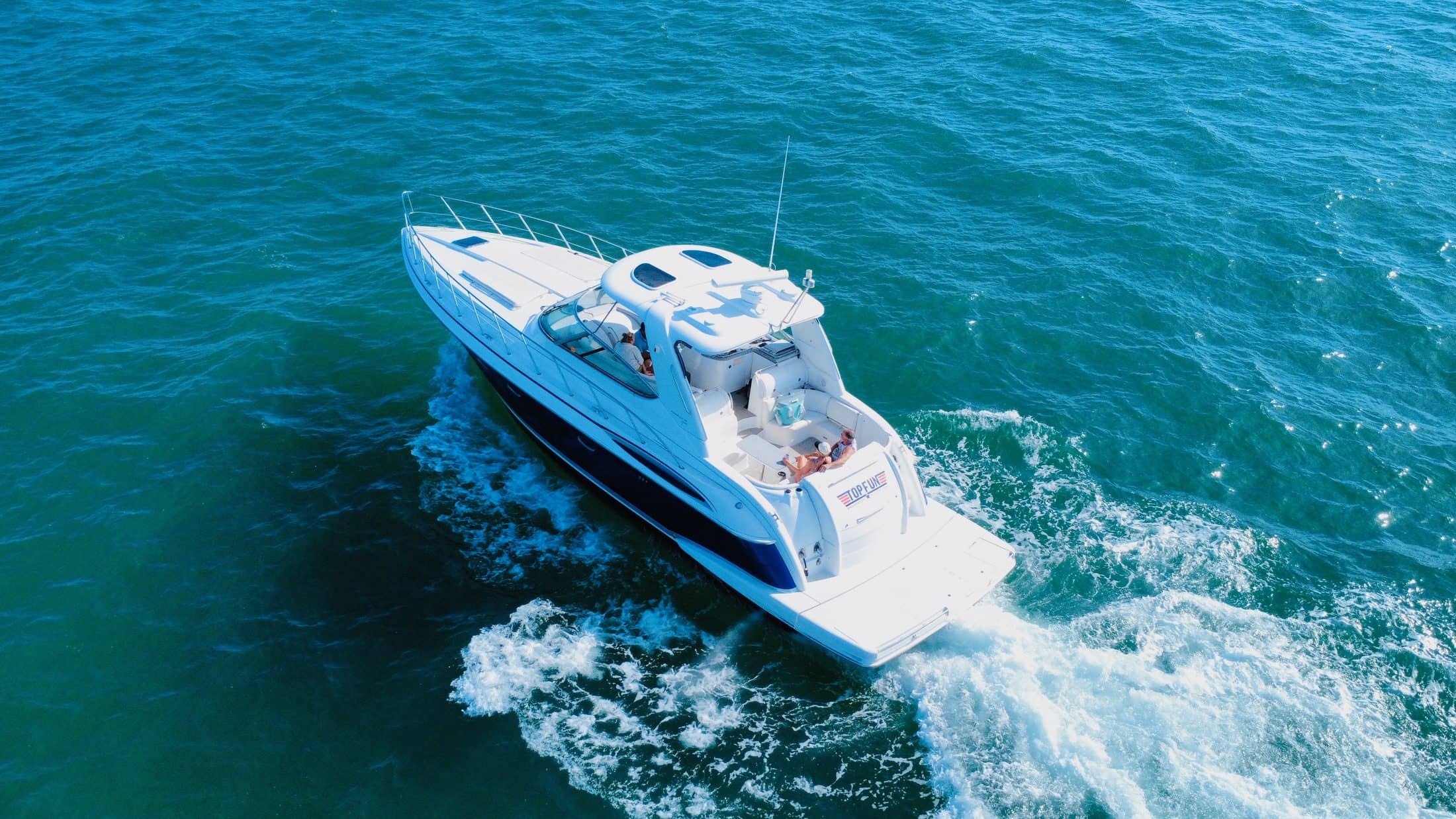 Top Fun yacht carving a wake across the Gulf near Anna Maria Island