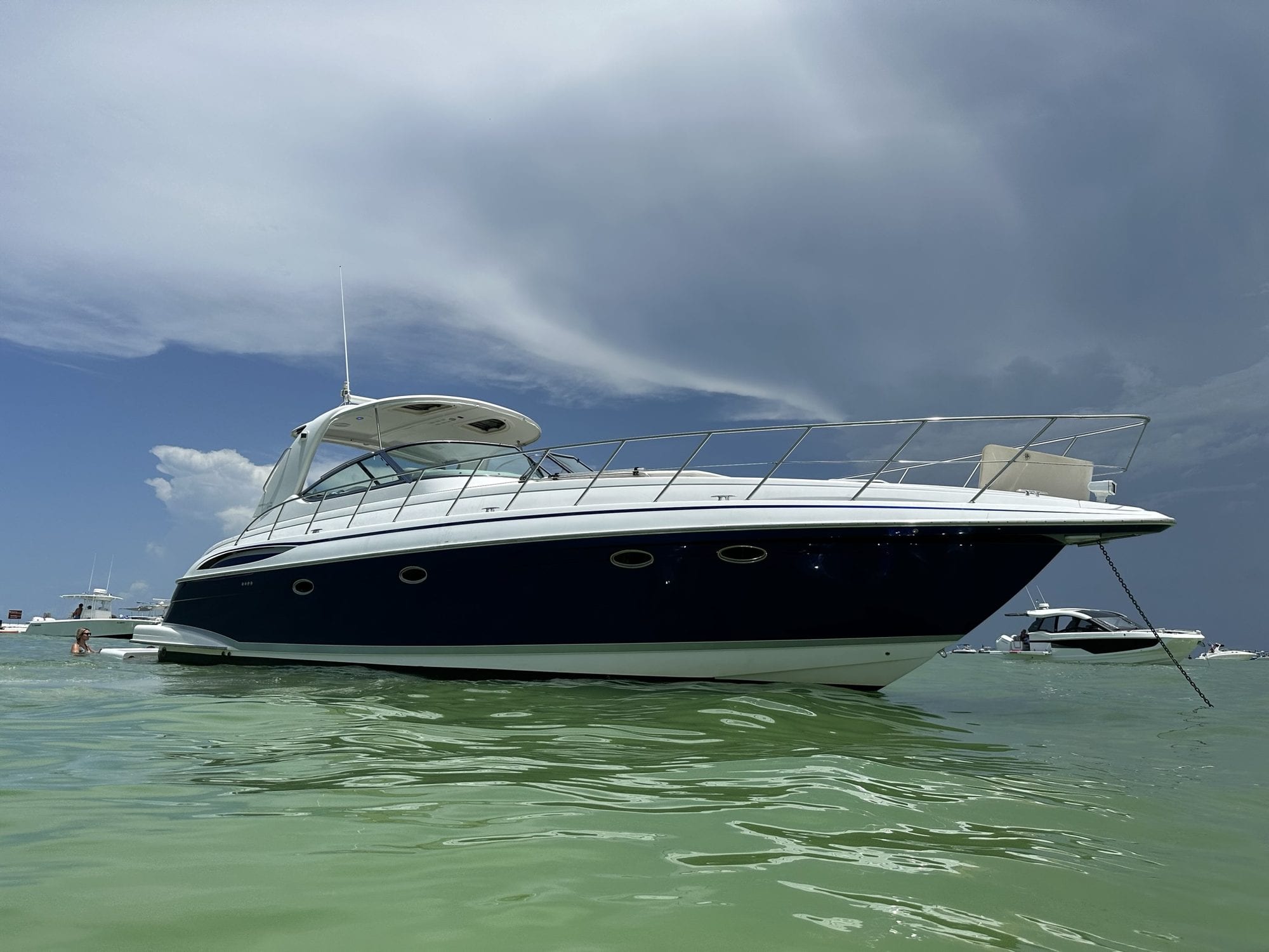 The 50-foot Top Fun luxury yacht anchored on a calm Gulf sandbar near Anna Maria Island